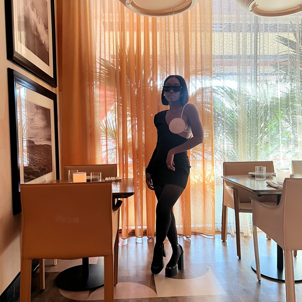 Black padded shoulder and rhinestone mini dress